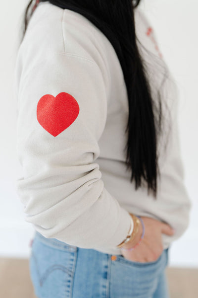heart on sleeve pullover sweatshirt